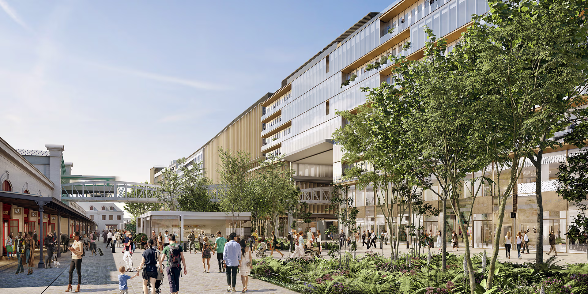 Architectural perspective of a modern urban district with glass-fronted buildings, green spaces and pedestrians walking along a lively pedestrian walkway.