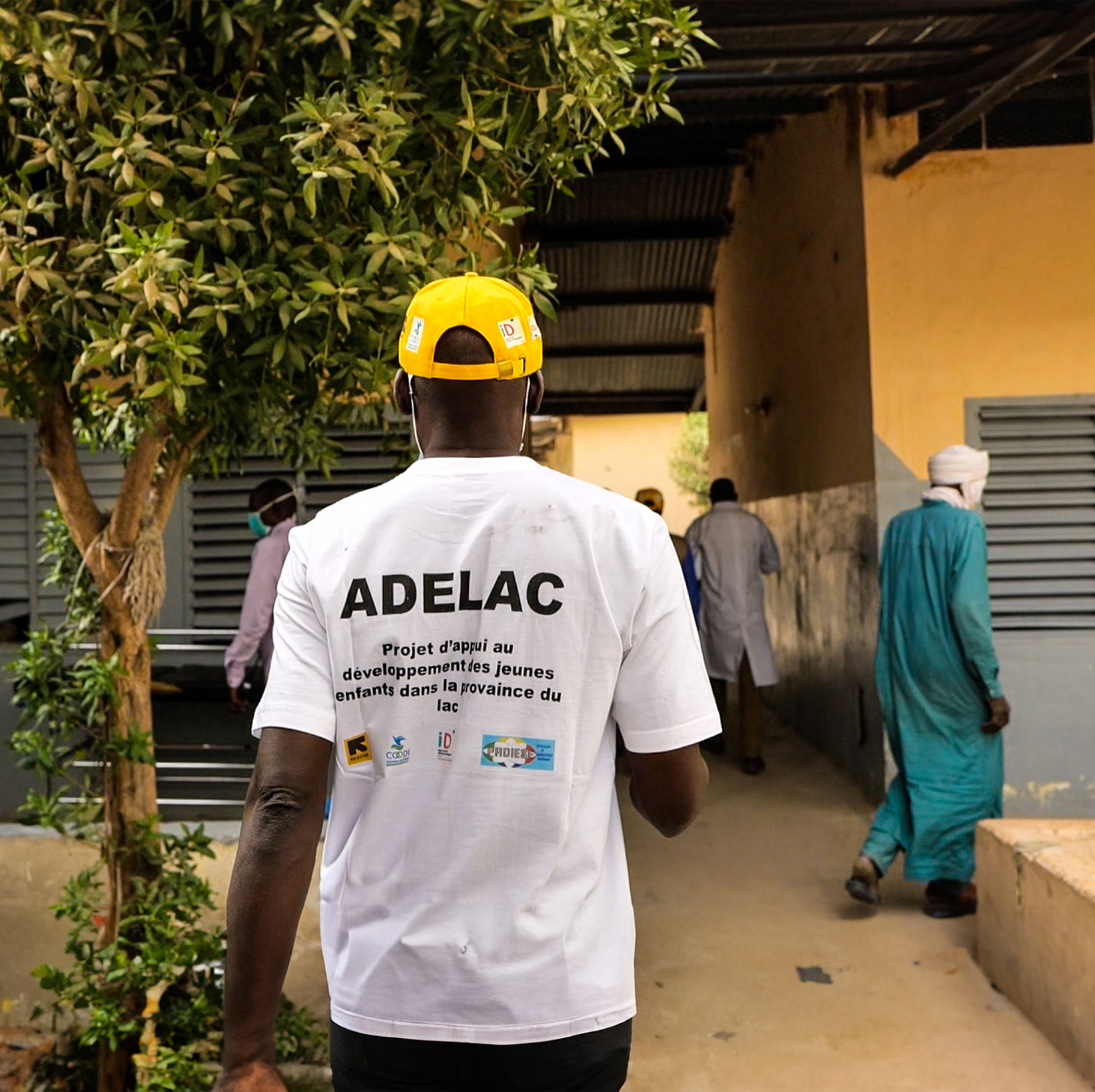 Man wearing an ADELAC T-shirt near the provincial hospital in BOL